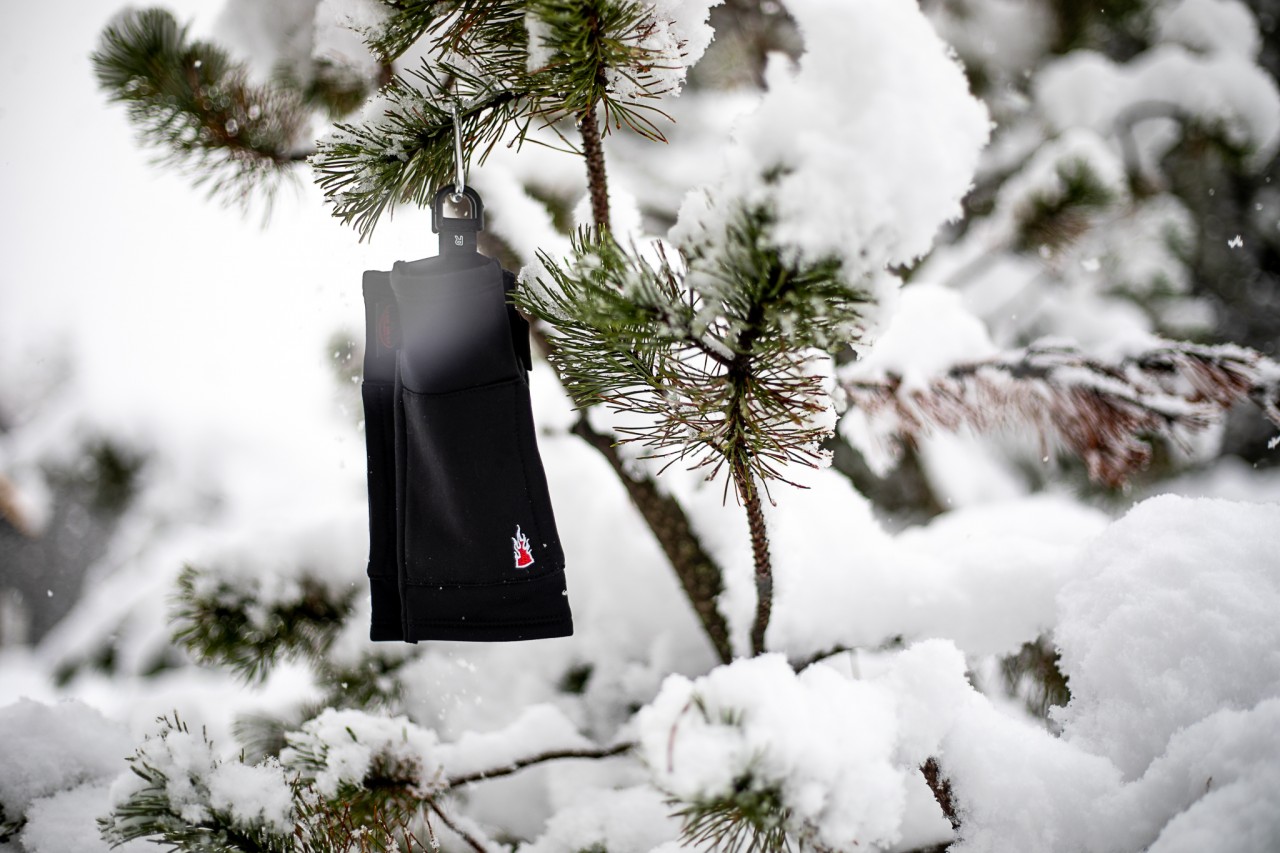 Finger glove hanging down from a branch