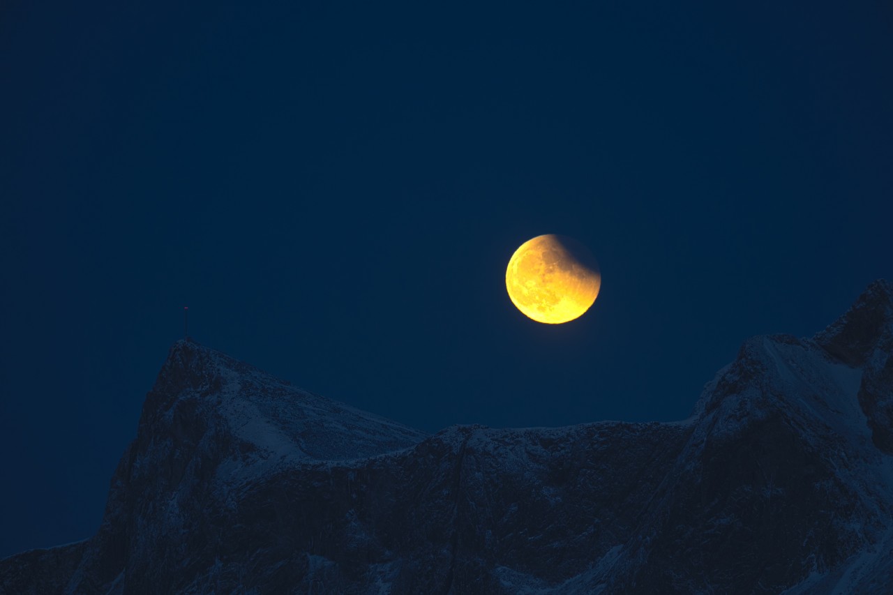 yellow orange moon on the Lofoten in Norway