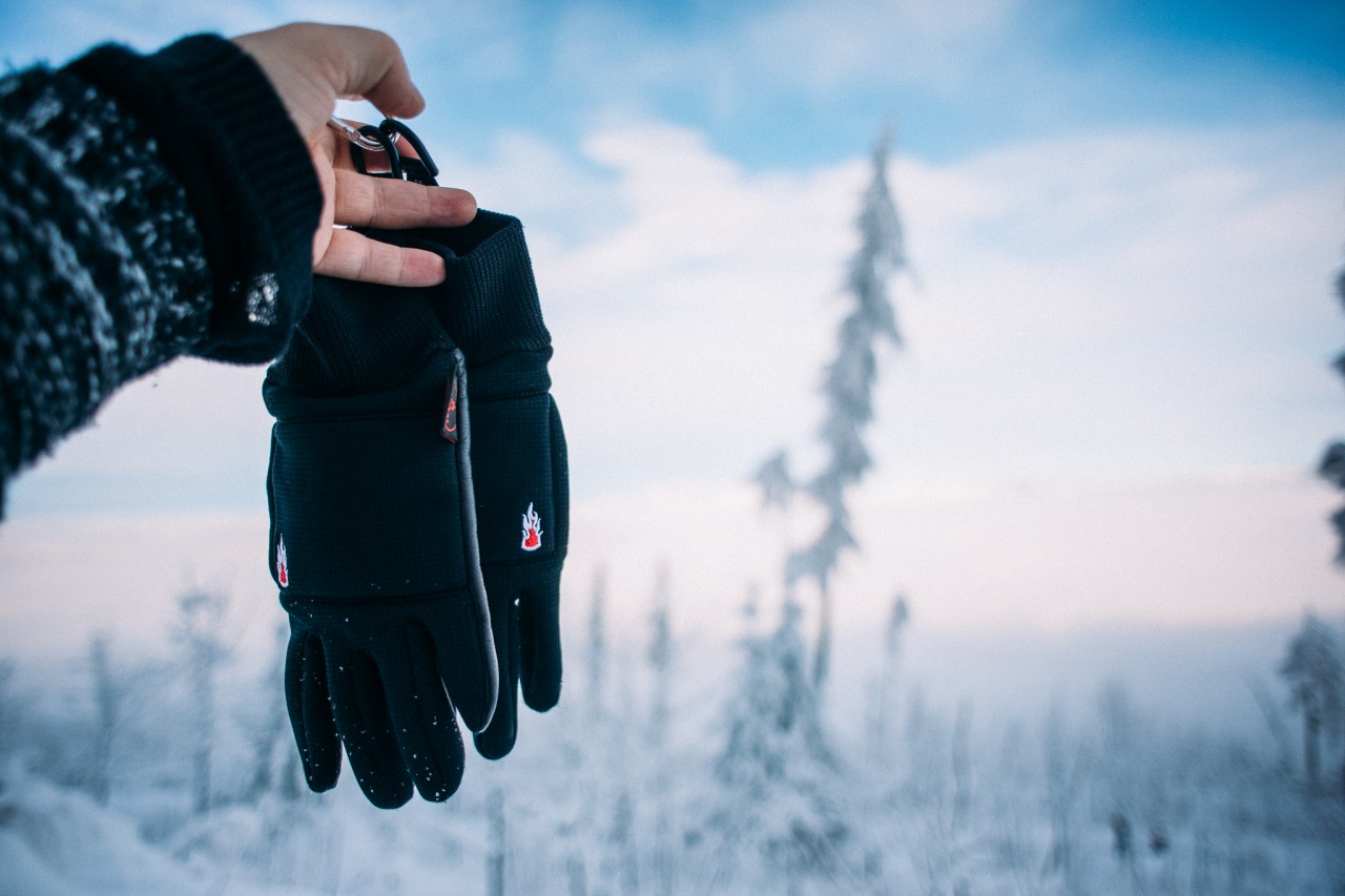 close up of a finger glove in snow