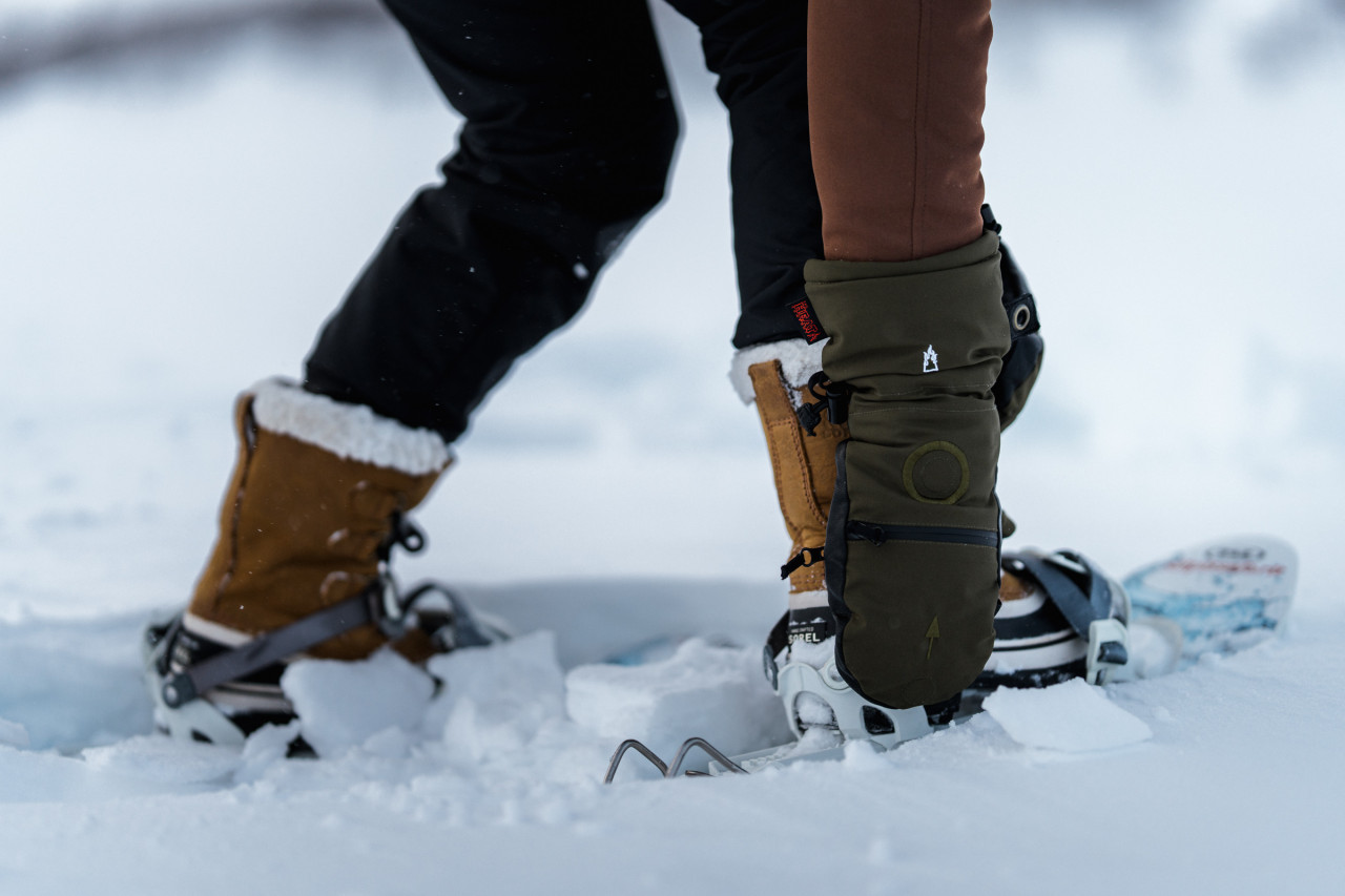 Close-up of a mitten in the snow