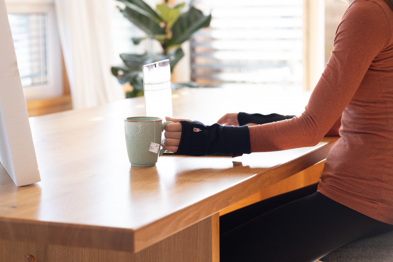 Woman with finger gloves in an office