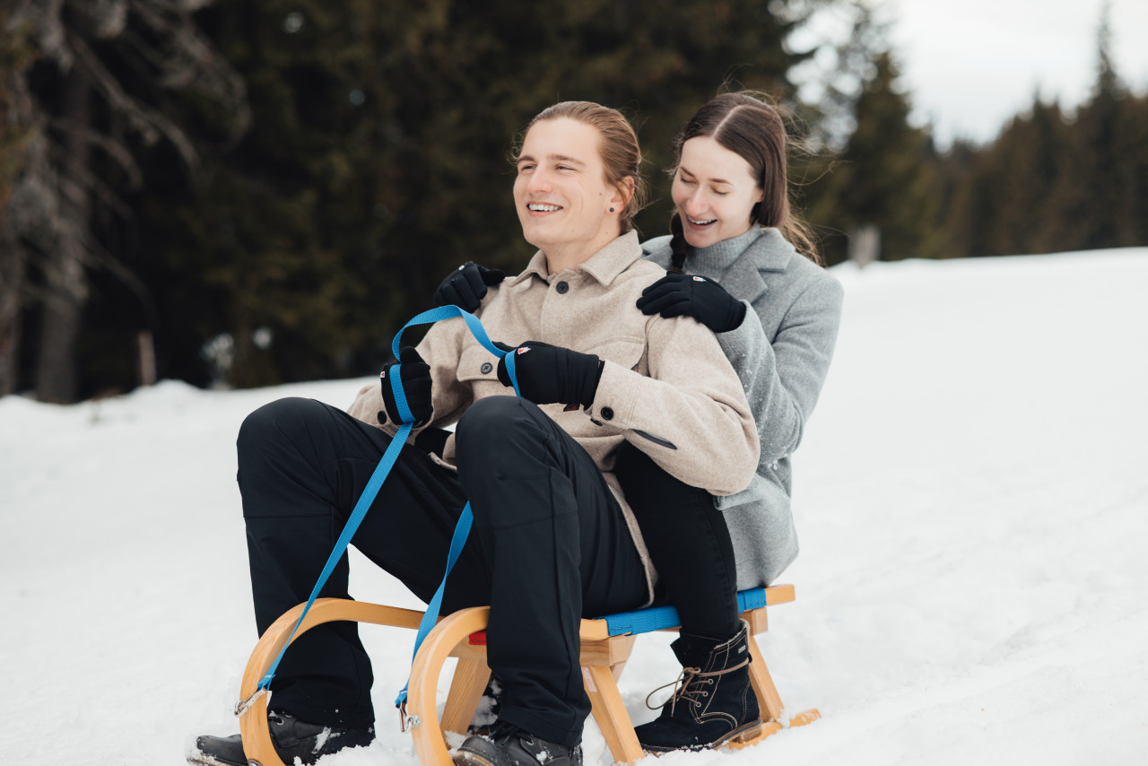 Happy couple on a sled